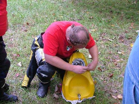 [Trying to remove the fuel pump assembly from a fuel tank.]