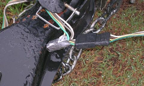 [The trailer wiring harness was repaired with duct tape until we could get home to repair it properly.]