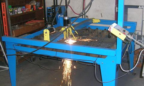 [Plasma cutter in action]