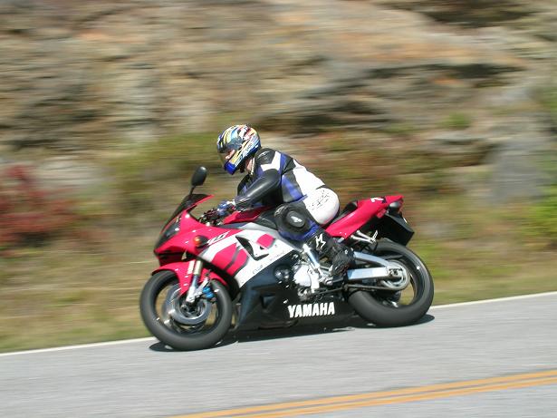 [Vicki shooting through a curve off of Hwy 215 in North Carolina.]