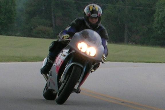 [Another shot of me riding the GSXR on the perimeter road behind the subdivision.]